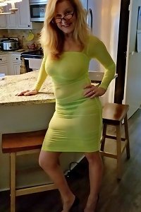 a sexy blonde mature girl getting her cock licked and massaged